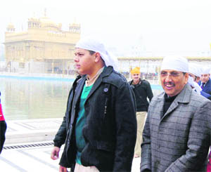 Subhash Joshi, Director General, Border Security Force, pays obeisance at the Golden Temple in Amritsar on Saturday.