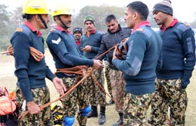 Personnel from various battalions (above and below) perform mock rescue operations on the Day I of the two-day training camp of National Disaster Response Force in Bathinda on Saturday.