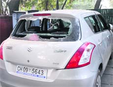 The damaged car at Sector 22 Police Post in Chandigarh on Saturday.