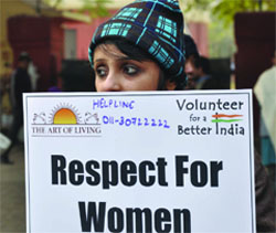 A girl holds a placard during a prayer meeting in memory of the gangrape victim in New Delhi on Saturday. 