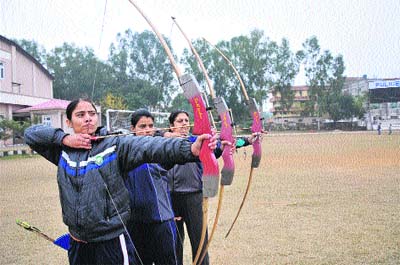 Women archers prepare ahead of the National Championship at Gulsham Ground in Jammu on Saturday.