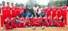 Members of the volleyball teams pose for a group photograph in Jammu on Saturday. 