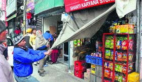 A shop being razed at Ghumar Mandi in Ludhiana on Saturday.