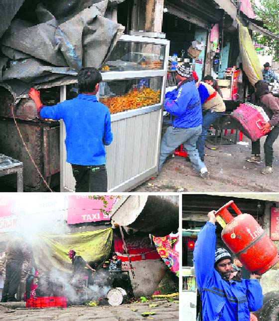 (Clockwise from top): Shopkeepers try to remove the encroachments to prevent their goods from getting confiscated from near Aarti Chowk; a worker of the tehbazaari wing carries a domestic LPG cylinder from outside a shop where it was being used for commercial purposes in the Ghumar Mandi area; and a shop from where temporary encroachments were removed from near Aarti Chowk in Ludhiana on Saturday.