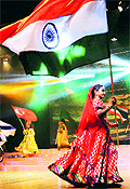 A child artiste carries the Tricolour at the 12th International Children's Festival of Performing Arts in Mumbai on Friday night
