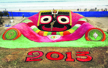 Artist Sudarsan Pattnaik creates a sand art of Lord Jagannath at Puri beach of Odisha to welcome the New Year.