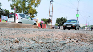 The potholed road outside DAV College has resulted in many mishaps in the past.