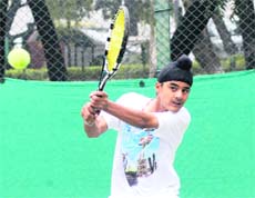 A player in action during the ITF Junior Circuit Tournament at CLTA stadium, Sector 10, Chandigarh, on Sunday. 