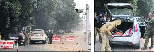 A CCTV camera installed at the entrance to Panjab University; and (right) security personnel check a car on the university campus on Sunday.