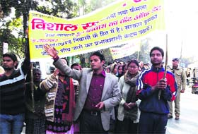 Members of the Rastriya Gorkha Morcha take out a march in support of their demands in Dehradun on Sunday