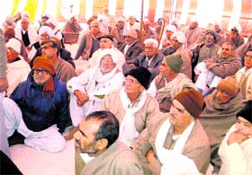 Members of Meham Chobisi panchayat stage a dharna Meham in Rohtak district on Sunday demanding reservation for Jats in jobs.