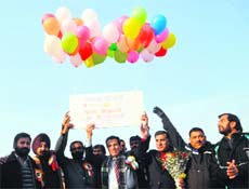 Minister for Youth Services and Sports RS Chib release balloons during the opening ceremony of 7th Christmas Gold Cup Football Tournament in Jammu on Sunday.