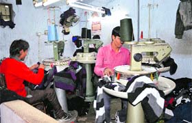 Workers busy at a hosiery unit, as fresh orders continue to pour in