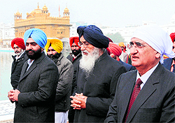 External Affairs Minister Salman Khurshid and Punjab Chief Minister Parkash Singh Badal at Golden Temple in Amritsar on Sunday