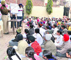 Traffic policemen brief students about the traffic rules at Sarvhitkari Vidya Mandir School at Mubarikpur village in Dera Bassi, Mohali district, on Monday. 