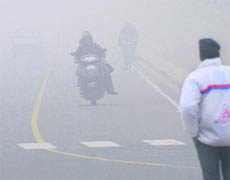 A traffic policeman mans a point in Chandigarh on Monday morning.