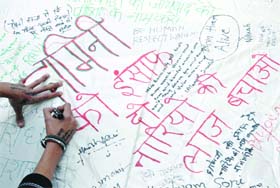 A demonstrator demands in her own way justice for Damini during a protest at Jantar Mantar in New Delhi on Monday
