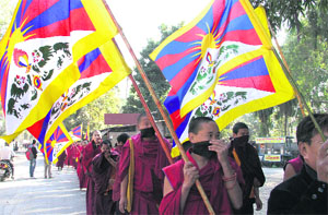 Tibetan monks take out a march against the Chinese atrocities in Dehradun on Monday.