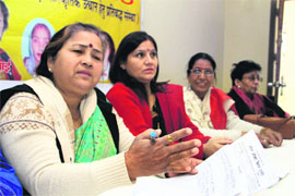 Members of the Mahila Adhikar Vikas Samiti address mediapersons in Dehradun on Monday.