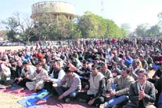Striking ministerial employees hold a demonstration in support of their demands at Parade Ground in Dehradun on Monday.