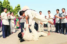 College girls participate in a basic judo camp for self-defence in Ahmedabad on January 5, 2013