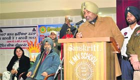 A traffic police official addresses students during a seminar at KMV Sanskriti Public School as a part of the Road Safety Week being observed in Jalandhar on Monday.