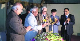 (Top) Punjab Local Bodies Minister Bhagat Chuni Lal lights a lamp at a function organised by the Nishkam Sewa Bharti Trust