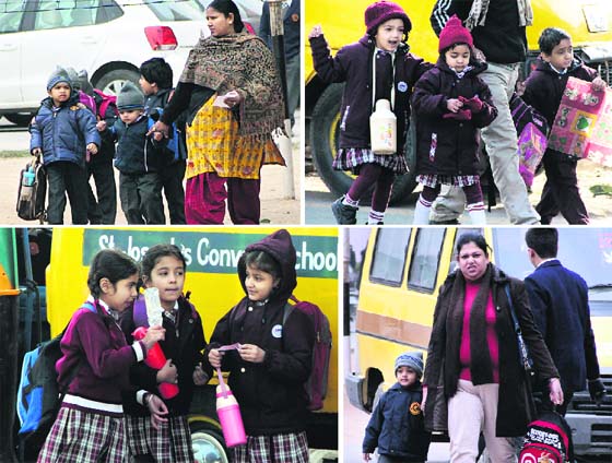 Children go to CBSE-affiliated private schools in bone-chilling weather conditions as their schools reopen after winter vacations in Jalandhar on Monday.