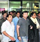 MIM MLA Akbaruddin Owaisi (2R) at the Rajiv Gandhi International Airport in Hyderabad on his return from London on Monday. 
