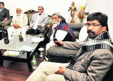 JMM supremo Shibu Soren and Jharkhand Deputy CM Hemant Soren along with party members during a core committee meeting of the party in Ranchi. 