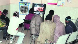 Drug addicts wait for their turn for medication at the Opiod Substitution Therapy Centre in Tarn Taran.