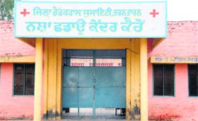 (Above) the locked gate of the de-addiction centre at Kairon village in Tarn Taran district