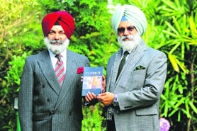 Drishinder Sandhawalia (right) and Birinder Sandhawalia with their fathers book