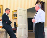 Barack Obama (L) with John Brennan.