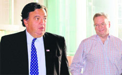 Eric Schmidt and Bill Richardson (L) leave after a meeting at a hotel in Beijing on Monday. 