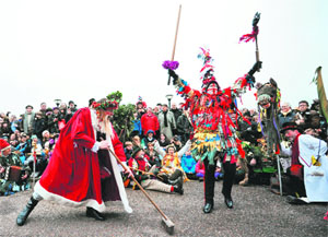 Actors from The Bankside Mummers group perform in a folk play near the Globe Theatre in central London on Sunday, in celebration of Twelfth Night, marking the end of the 12 days of winter festivities.