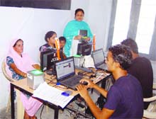  Residents get their UID cards prepared during the 2nd phase of enrollment drive in Amritsar in June 2012.