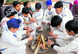 Buddying cricketers sit around a bonfire after playing a cricket match at St Soldiers School, Sector 28, in Chandigarh on Tuesday