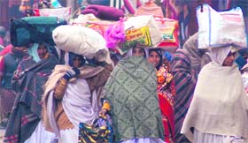 Devotees from different states of the country reach Haridwar for a holy bath in the Ganga on Tuesday.