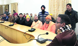 BVRC Purshottam, District Magistrate, Dehradun, chairs a meeting of officials and public representatives on cleanliness in Dehradun on Tuesday. Tribune photo: Vinod Pundir