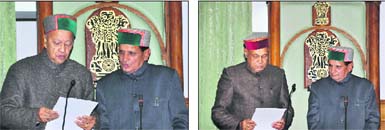 Pro-Tem Speaker Mansa Ram administers the oath to Chief Minister Virbhadra Singh and (right) former Chief Minister PK Dhumal at Tapovan near Dharamsala on Tuesday.
