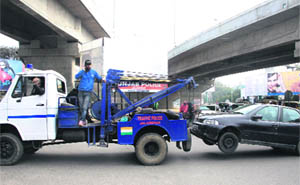 The traffic police tows away a wrongly parked vehicle near BMC Chowk in Jalandhar on Tuesday. 