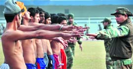 Youngsters undergoing check for tattoos during the recruitment rally in Ludhiana.