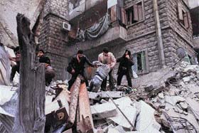 An injured being taken out from the rubble of a building targeted by a missile in the al-Mashhad neighbourhood of Aleppo in Syria. The UN recently denounced a "proliferation of serious crimes including war crimes" in Syria.