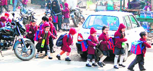 Children of primary classes come out of a school in Amritsar on Wednesday.