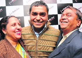An elated Anshul Garg celebrates his success with his parents in Chandigarh on Wednesday