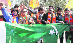 Members of the Shiv Sena burn Pakistan flag in Dehradun on Wednesday in protest against the killing of two Indian soldiers by Pakistani troops. Tribune photo : Vinod Pundir 