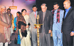 Chief Minister Vijay Bahuguna inaugurates a Ganga Mahotsava programme by lighting the traditional lamp in Haridwar on Wednesday.