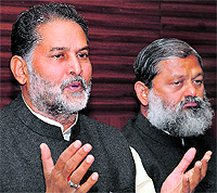 Newly elected BJP Haryana president Ram Bilas Sharma along with BJP leader Anil Vij address a press conference at Chandigarh on Wednesday