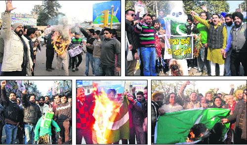 Activists of the ABVP; Janjagriti Manch; Congress; IT Cell of the district unit of the BJP; and shopkeepers burn the Pakistani national flag in Jalandhar on Wednesday. 